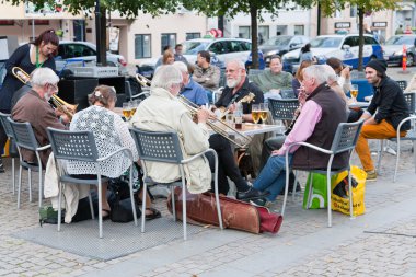 Small amateur jazz band in outdoor restaurant in Copenhagen clipart