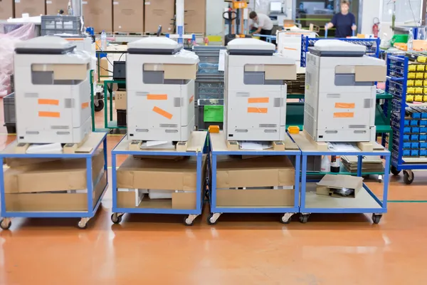 Several assembled copiers on factory — Stock Photo, Image
