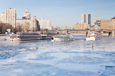 Iceboats and fisherman on frozen Moscow river clipart