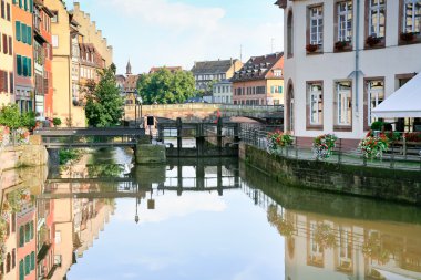 Ill river canal in old town Strasbourg, France clipart