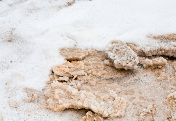 Crystalline salt on beach of Dead Sea