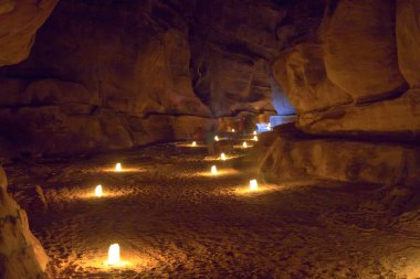 Narrow gorge The Siq in Petra at nignt clipart