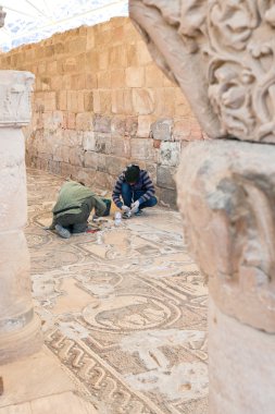 Restoration works in Byzantine church in Petra clipart