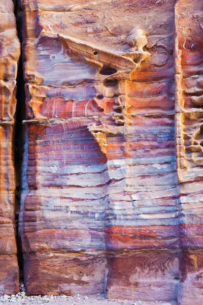 Unfinished tomb in multicolour sandrock of Petra — Stock Photo, Image