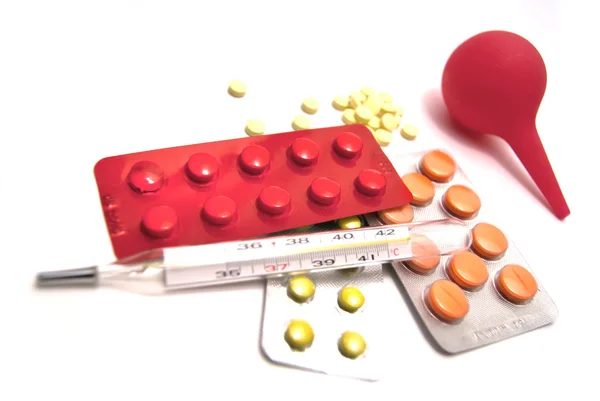 Tablety, klystýr a teploměr — Stock fotografie