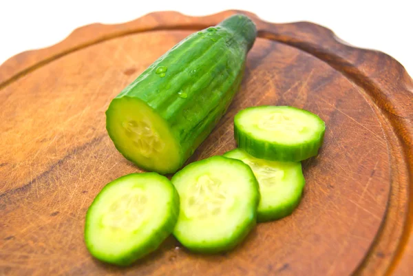 Cucumber on cutting board — Stock Photo, Image