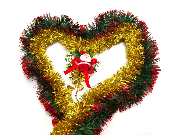 Heart of tinsel and Santa figurine — Stock Photo, Image