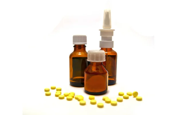 Three bottles of medication and pills — Stock Photo, Image