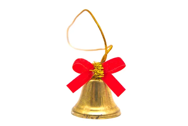 Cloche dorée avec ruban rouge close-up — Photo