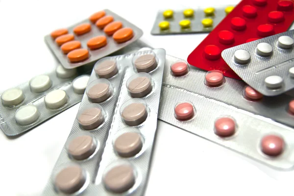 Three bottles of medication and tablets — Stock Photo, Image