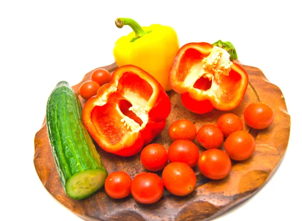 Verduras en una tabla de cortar en blanco — Foto de Stock
