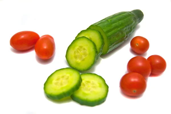 Cucumber and cherry tomatoes on white — Stock Photo, Image