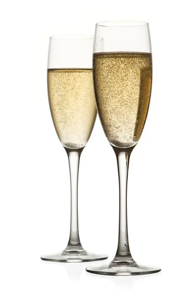 Two glasses of champagne. Isolated on white background Royalty Free Stock Images