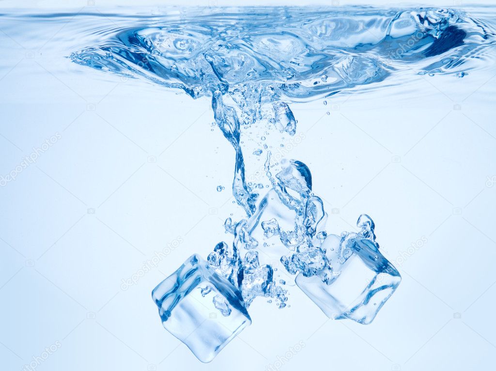 A background of bubbles forming in blue water after ice cubes ar