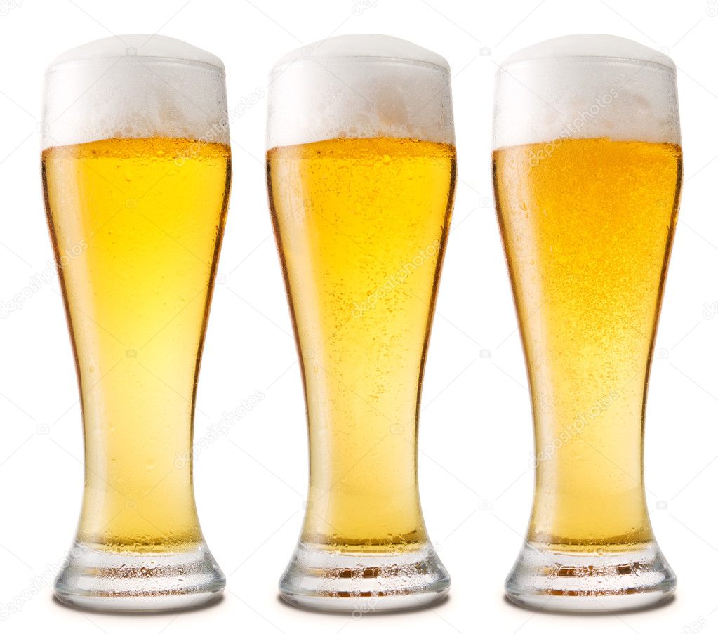 Beer into glass isolated on white.