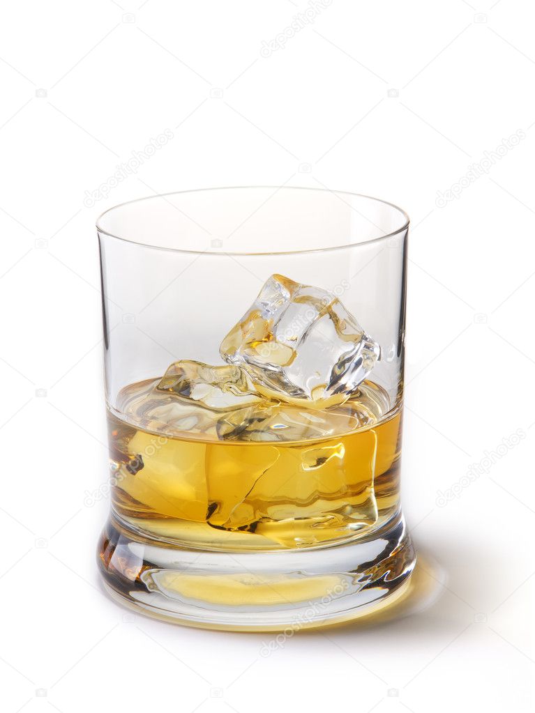 Gold whiskey with ice cubes, on a white