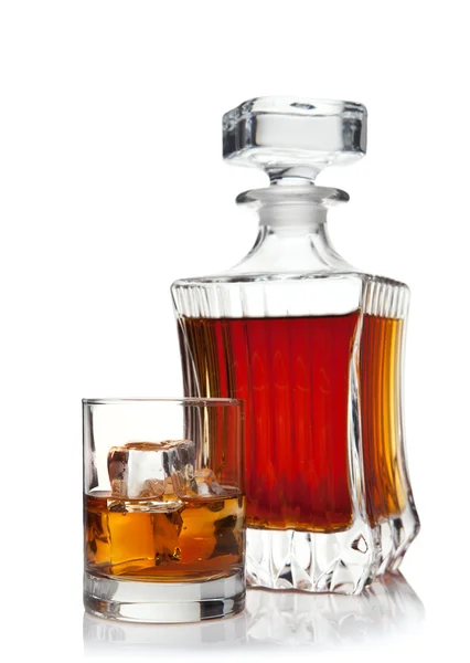 Glass and decanter of brandy — Stock Photo, Image