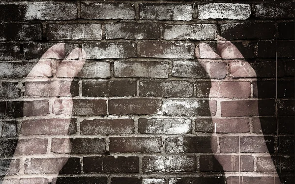 Hand und Ziegelmauer — Stockfoto