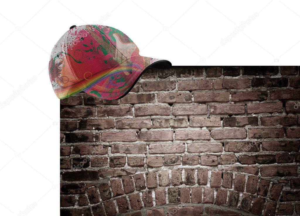 Music and rainbow colored hat on the brick wall