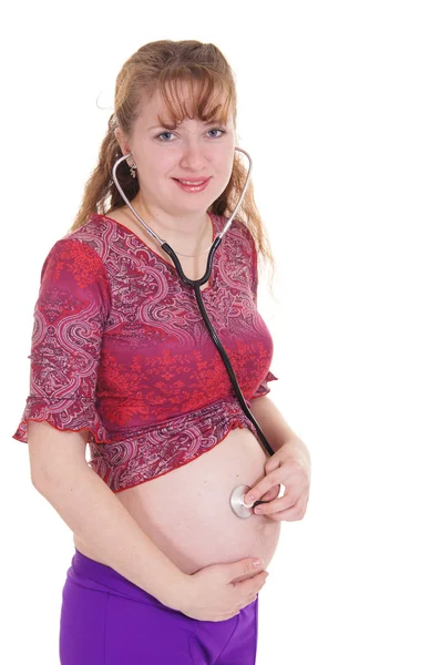 Gravid kvinna med stetoskop — Stockfoto