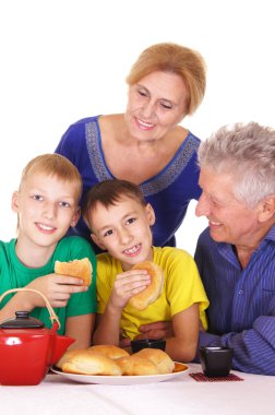 Family eating at table clipart