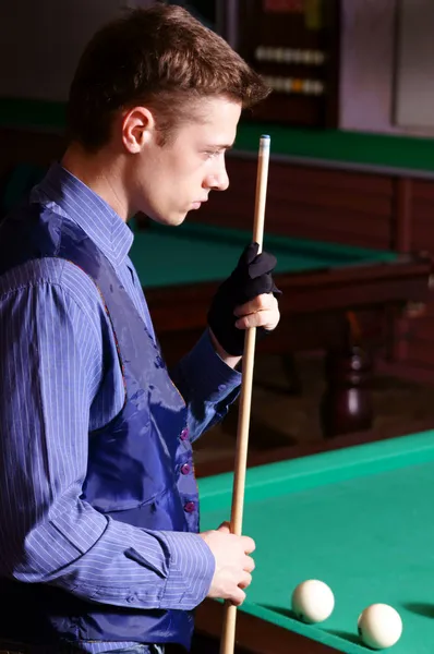 Billiards table and man Royalty Free Stock Images