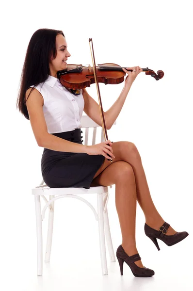 Pretty girl with violin at chair — Stock Photo, Image