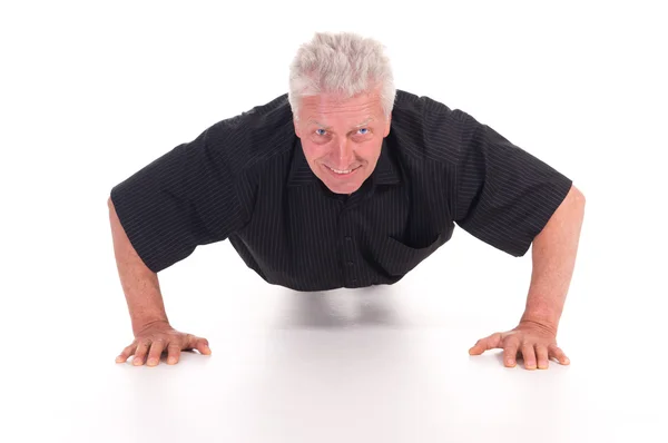 Oude man doet push-ups — Stockfoto