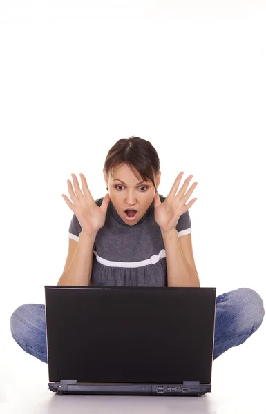 Shocked woman at laptop Stock Photo