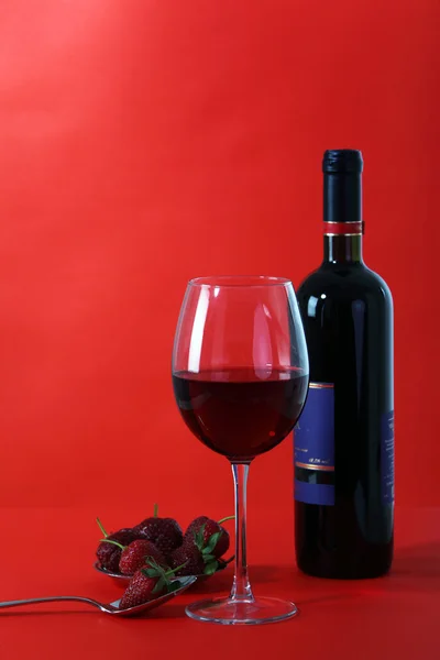 Red wine on red background — Stock Photo, Image