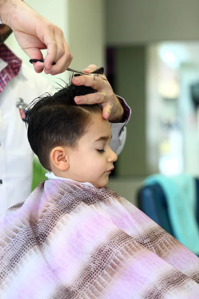 Lovely child at hairdresser — Stock Photo, Image