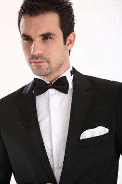 Handsome man in tuxedo clipart