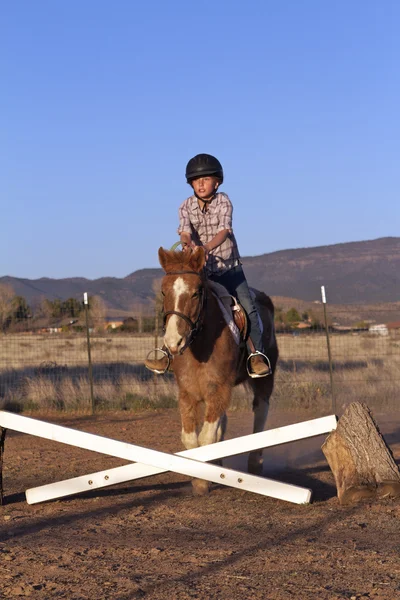 Young Girl Jumping Pony — Stock Photo, Image