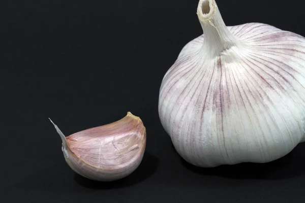 stock image Segment and the whole garlic in a peel