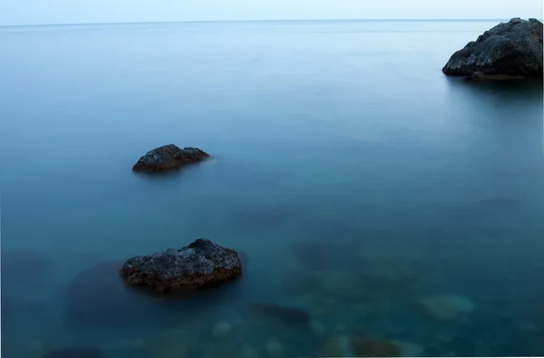 Three stones in the sea — Stock Photo, Image