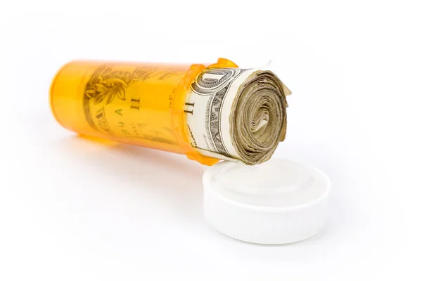 Medicin piller flaska och dollar — Stockfoto