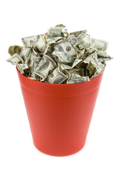 Dólares en lata de basura roja — Foto de Stock