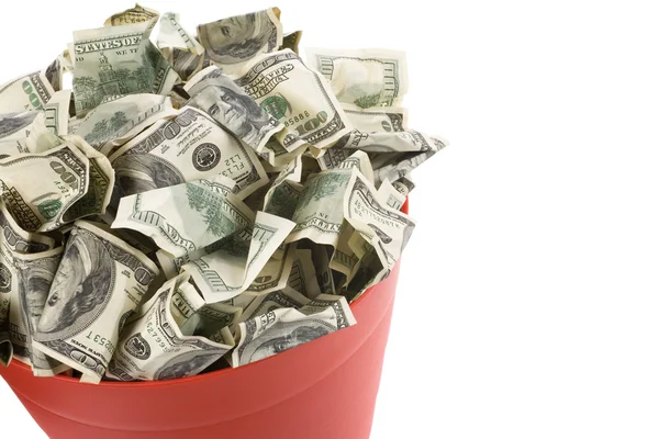 Доллары в мусорном баке — стоковое фото