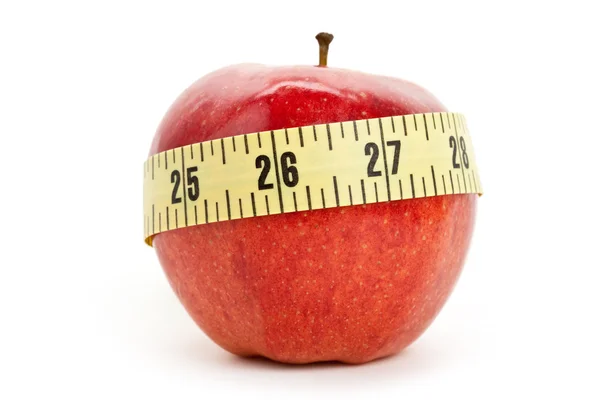 Kırmızı elma ve şerit metre — Stok fotoğraf