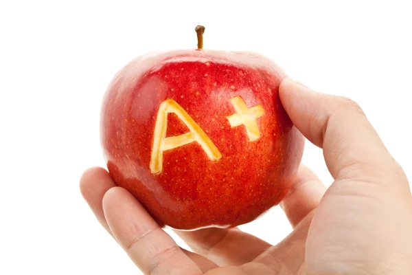 Czerwone jabłko oraz znak plus — Zdjęcie stockowe