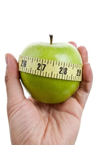 Zielone jabłko i centymetrem — Zdjęcie stockowe