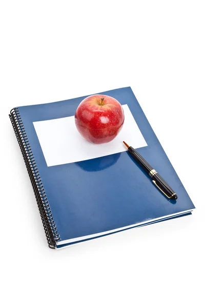 Rode appel en leerboek Rechtenvrije Stockafbeeldingen