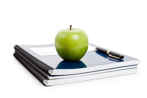 Green apple and Textbook — Stock Photo, Image