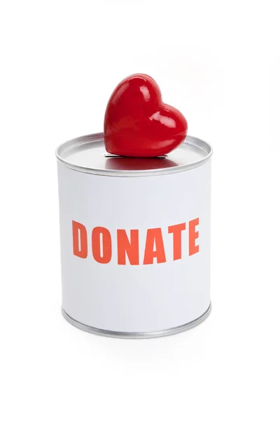 Spendenbox und rotes Herz — Stockfoto
