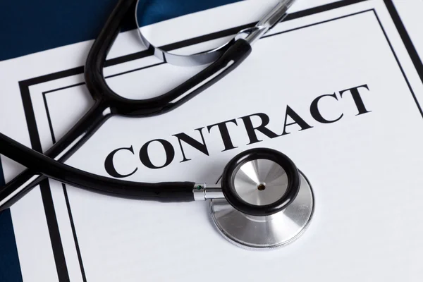 stock image Stethoscope and Contract