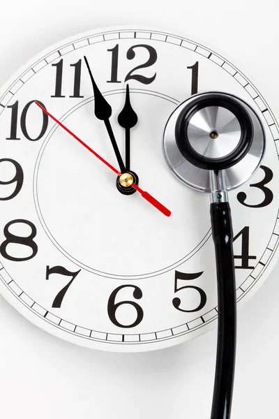 Stéthoscope et horloge — Photo