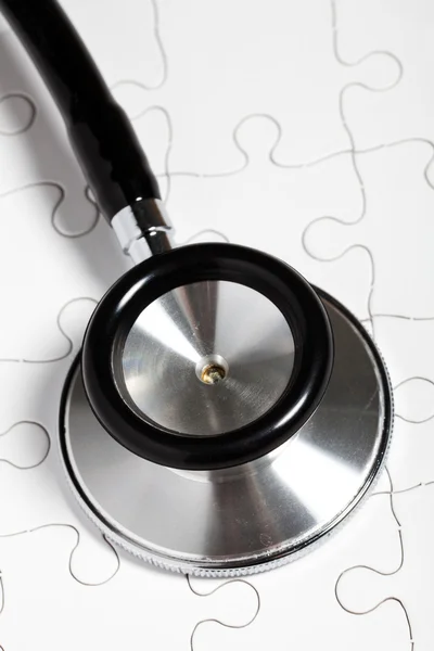 Stethoscope and puzzle — Stock Photo, Image