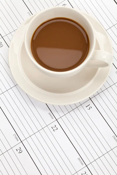 Filiżanka kawy i kalendarz — Zdjęcie stockowe
