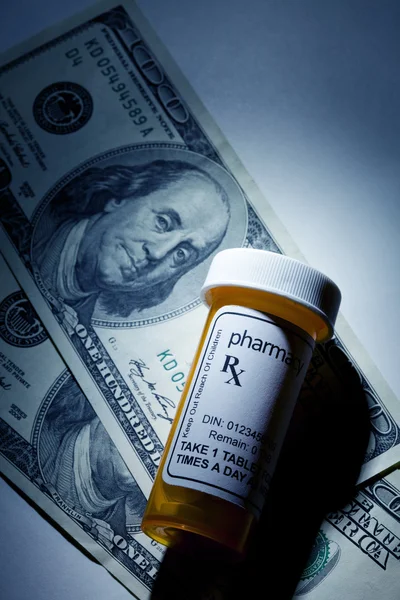 Pill Bottle and dollar — Stock Photo, Image