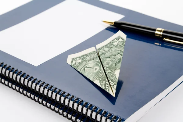 Blue school textbook and dollar — Stock Photo, Image